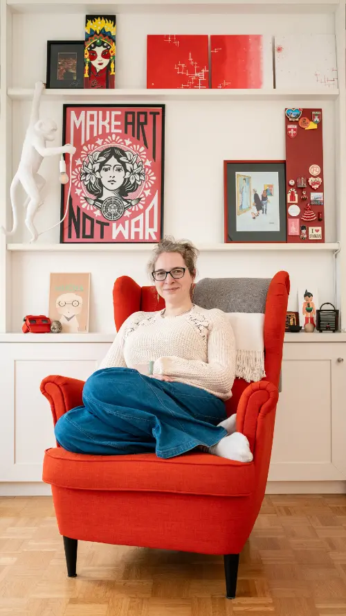Elisa in a chair in her home