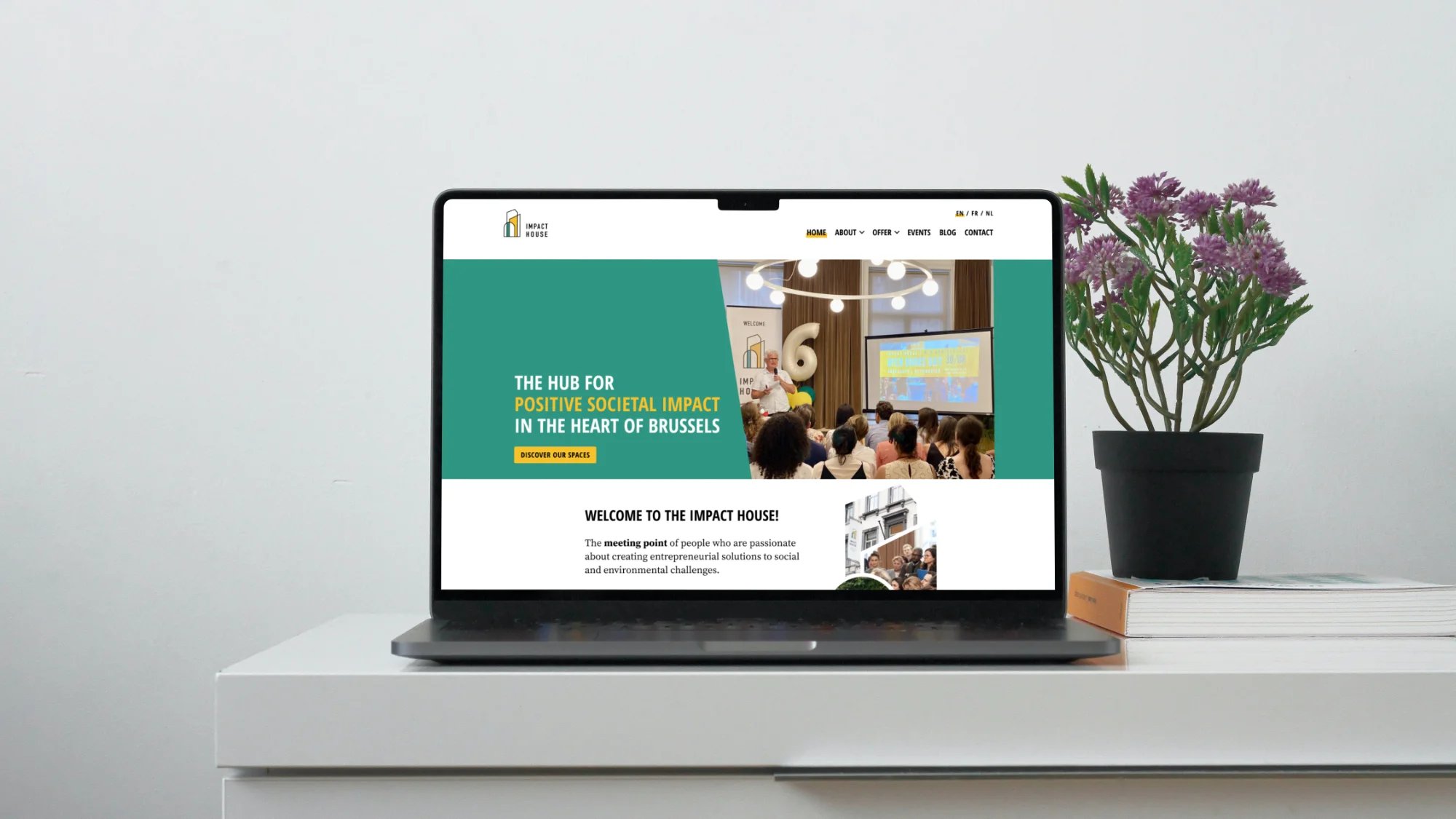 Impact House website laptop mockup
